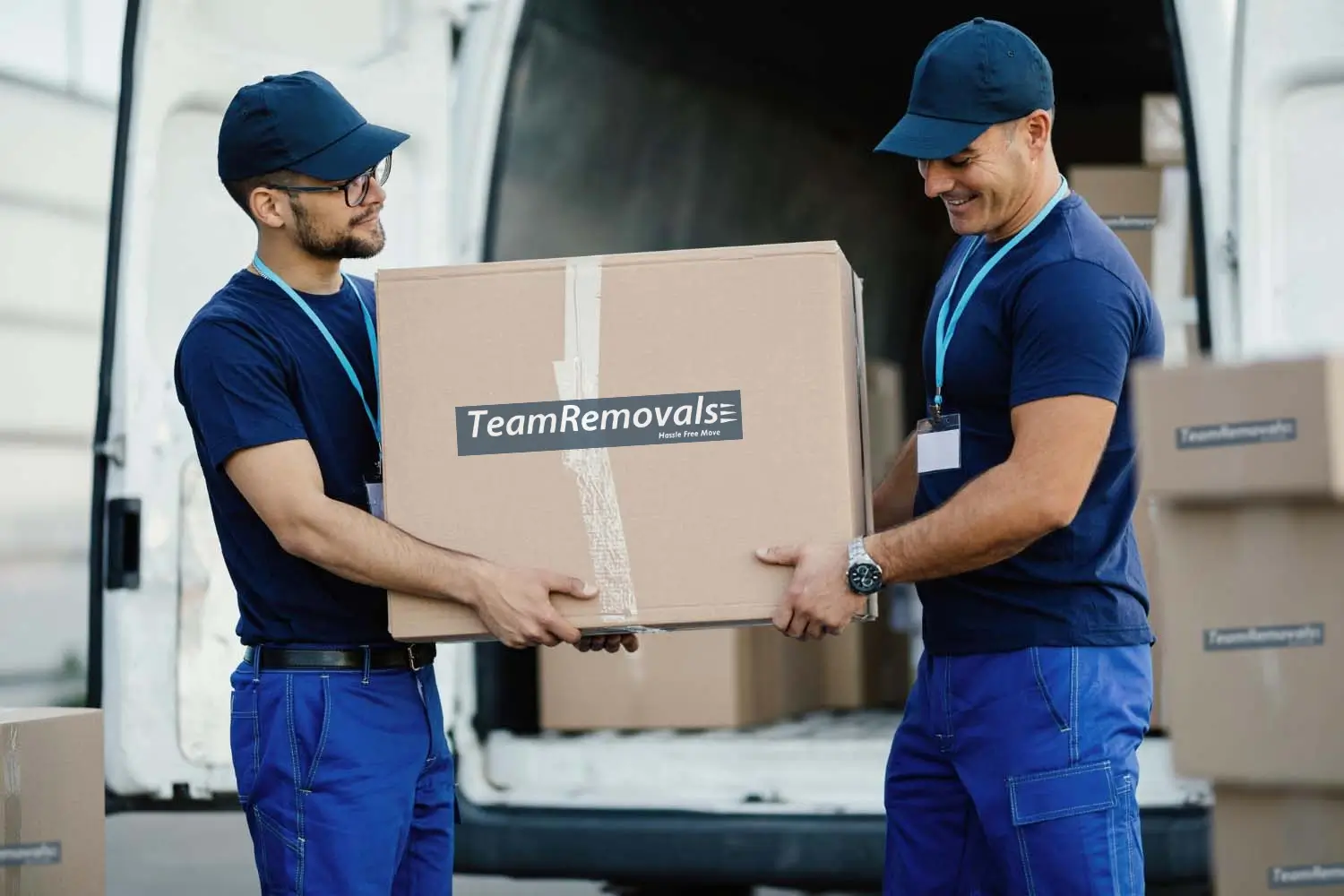 Movers Picking Up Cardboard Boxes